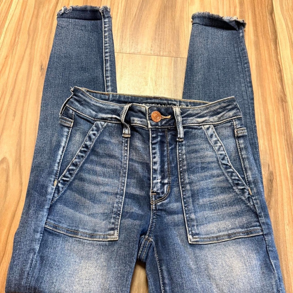 American Eagle blue denim jeans with frayed hem